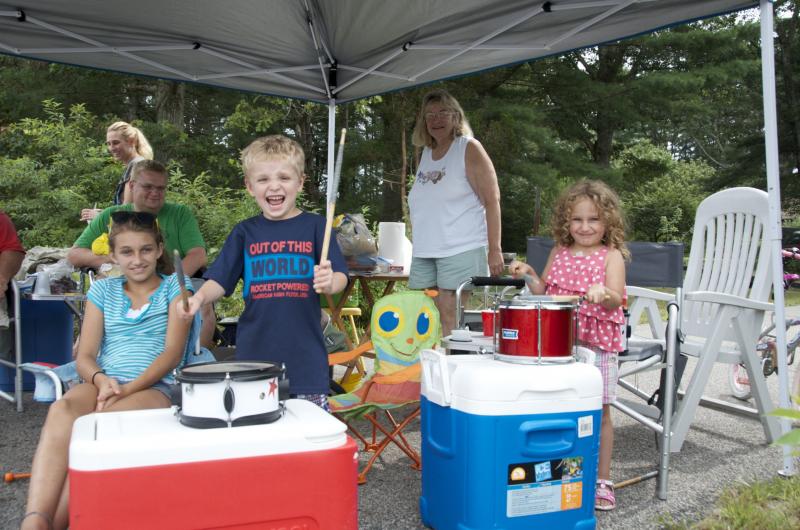 Just up the street from the Marchisio post, the Boucher's set up their annual stand to cheer on and provide water for bike riders. Nathan Baldwin and Kayla Boucher also provided musical entertainment. BY GEORGIA SPARLING