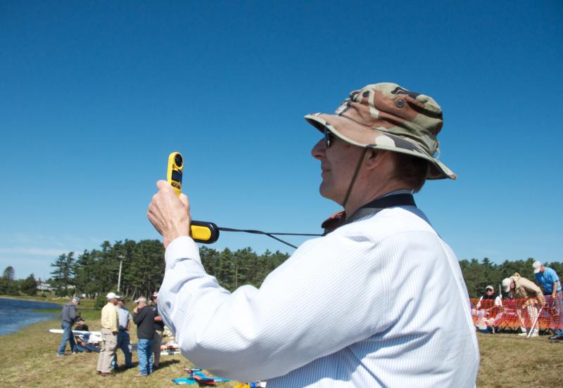 Ned Watts checks the wind speed before deciding if he should put his plane in the sky. BY GEORGIA SPARLING