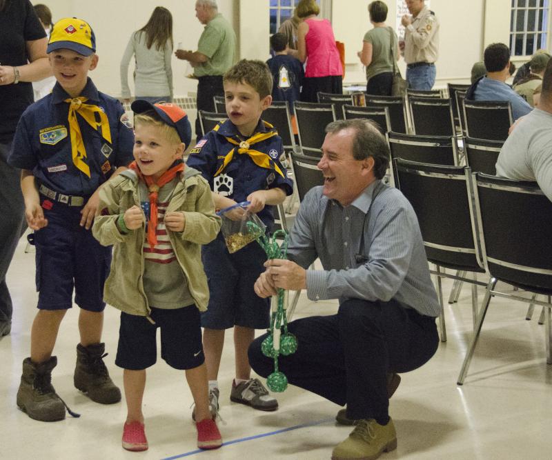 Blake Moreau, 5, is an "aspiring scout" said his dad. Here, he practices his monkey fist tossing skills with leader Mark Mooney. BY GEORGIA SPARLING