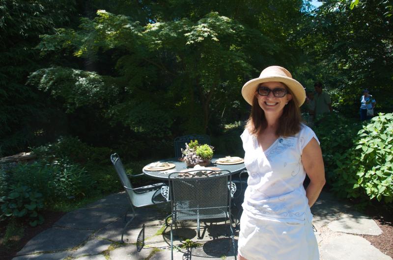 Sandy Hering, a member of the Mattapoisett Woman's Club, helps host at the home of Nancy Fletcher. BY GEORGIA SPARLING