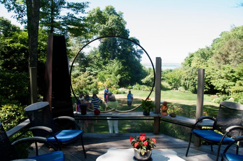 Merry and Ralph Eustis' home on Point Connett has a view of the water and a variety of interesting sculptures throughout the yard. BY GEORGIA SPARLING
