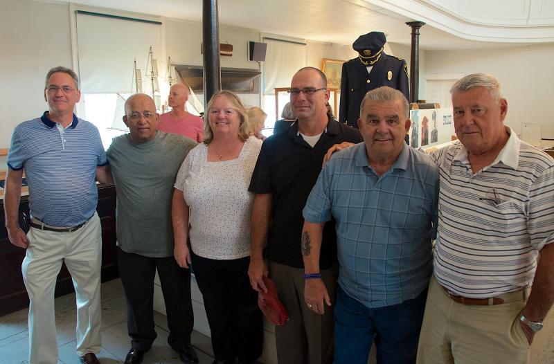 Past and present members of the Mattapoisett Police Department gather at the Mattapoisett Historical Society Muesum. From left: Kent Davis, Ed Pina, Chief Mary Lyons, Capt. Anthony Days, Ken Pacheco and former Chief James Moran. BY GEORGIA SPARLING