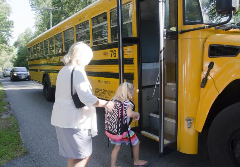Mary Russell accompanies her granddaughter, Abby Balsis, on her first school bus ride. BY GEORGIA SPARLING