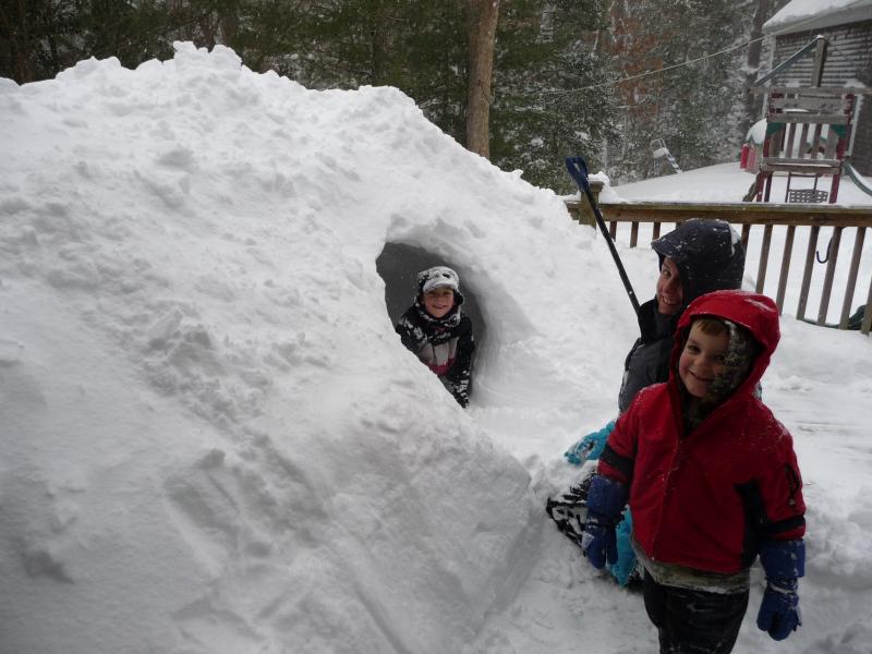 Elizabeth Hutchinson and sons, Oscar and Oliver make a snow fort. COURTESY ART HUTCINSON