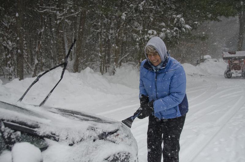 Lynn Nelson cleans out part way through the storm. BY GEORGIA SPARLING