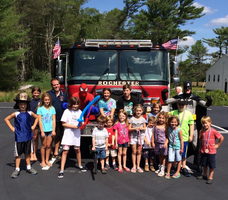 Summer reading participants wrapped up the nine-week program on Saturday with a “Hero-bration” that featured a visit from Batman and Spider-Man. COURTESY LISA FULLER