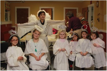 Abigail Fortin, Kate Plante, Lillian Thompson, Annabel Trahan, Cecelia Trahan, Grace Brown and Isaiah Burlinson (back row) are angels in waiting before the pageant begins. COURTESY LISA DUNN/ALWAYSDUNNRIGHT PHOTOGRAPHY
