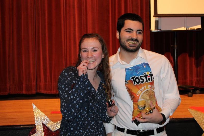 Abhlin Fitzpatrick and Nick Kondraki pose with a bag of Tostitos chips after being awarded Largest Appetite in the senior class. BY SARA LAFRANCE