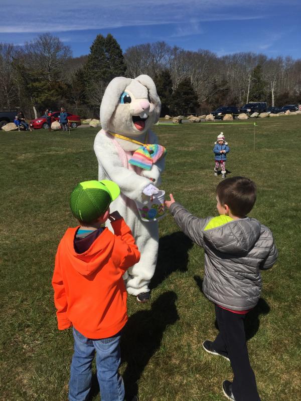 Jack Czerkowicz and Jack Higgins, both 6 and of Mattapoisett, receive lollipops from the Easter bunny. BY SARA LAFRANCE