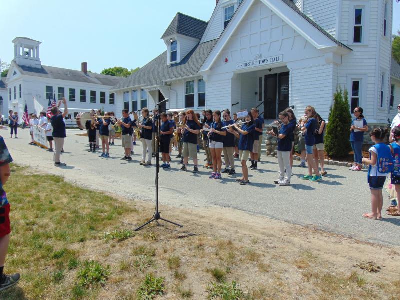 Rochester Memorial's fifth and sixth grade band members play the national anthem before the parade. BY TANNER HARDING