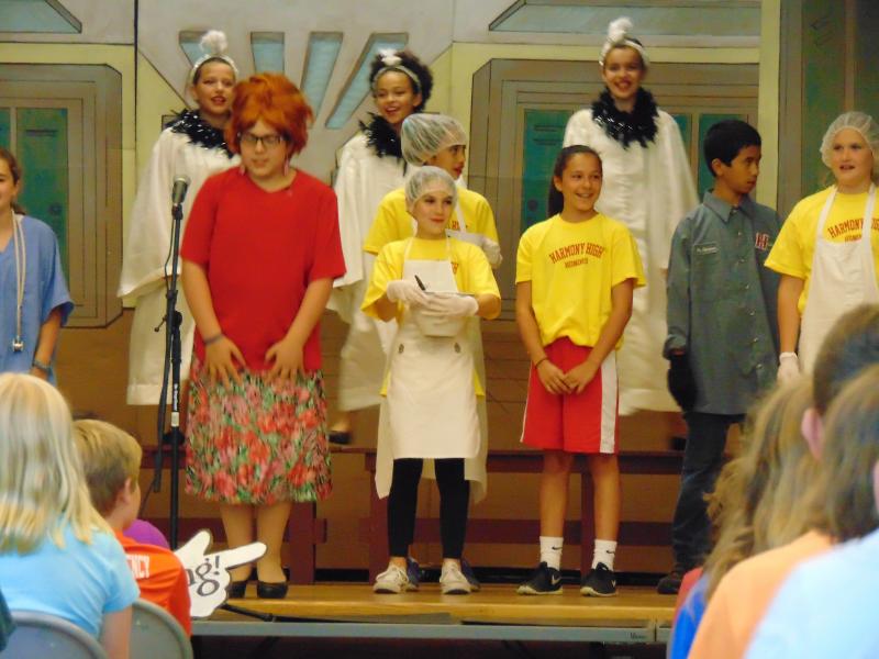 At Harmony High, everyone sings, even the principal, cafeteria workers and gym teacher. BY TANNER HARDING