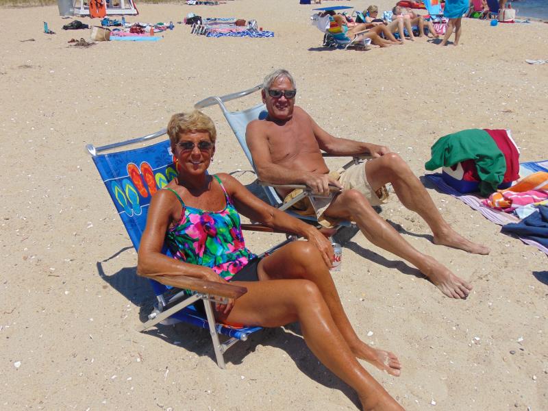 Dave and Chris Watling enjoy the sun and sand in their usual spots at Silvershell Beach. "I love the fireworks here," Chris said. "I love knowing everyone at the beach. It's a great beach and very family friendly." Dave loves to remember his son exploring marine life. "When my son was young and would come with his friends, they would go at low tide and look at the crabs and crayfish," he said. BY TANNER HARDING