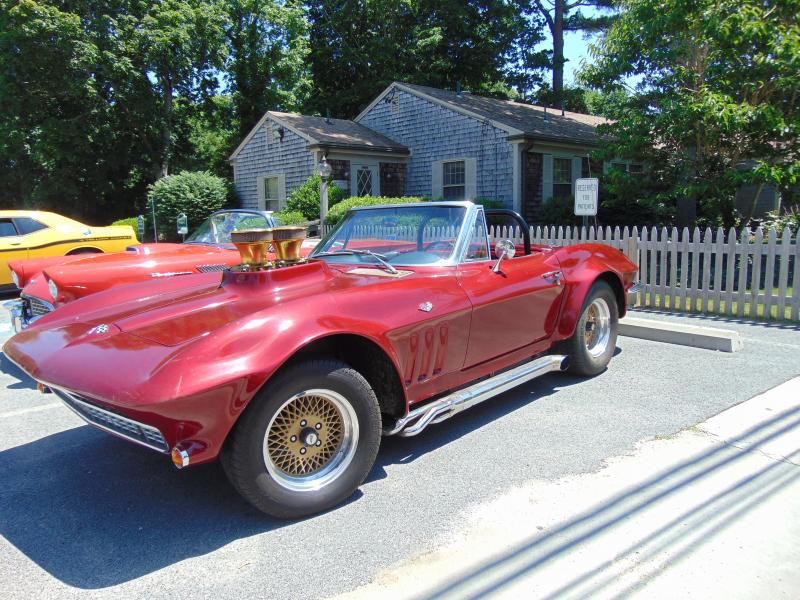 Mark MacKenzie also owns this 1965 Corvette, who bought and restored the car from a neighbor. BY TANNER HARDING