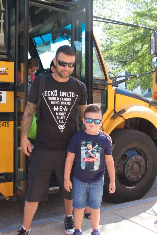 Anthony Debano and Kammie Pacheco (not pictured) rode the bus with their son Angelo Debono to Center School on Tuesday. The Mattapoisett tradition helps ease kindergartners into their new routine. BY GEORGIA SPARLING