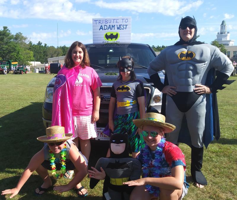 The Mackenzie family and their parade entry -- a tribute to the original Batman, Adam West. BY ANDREA RAY