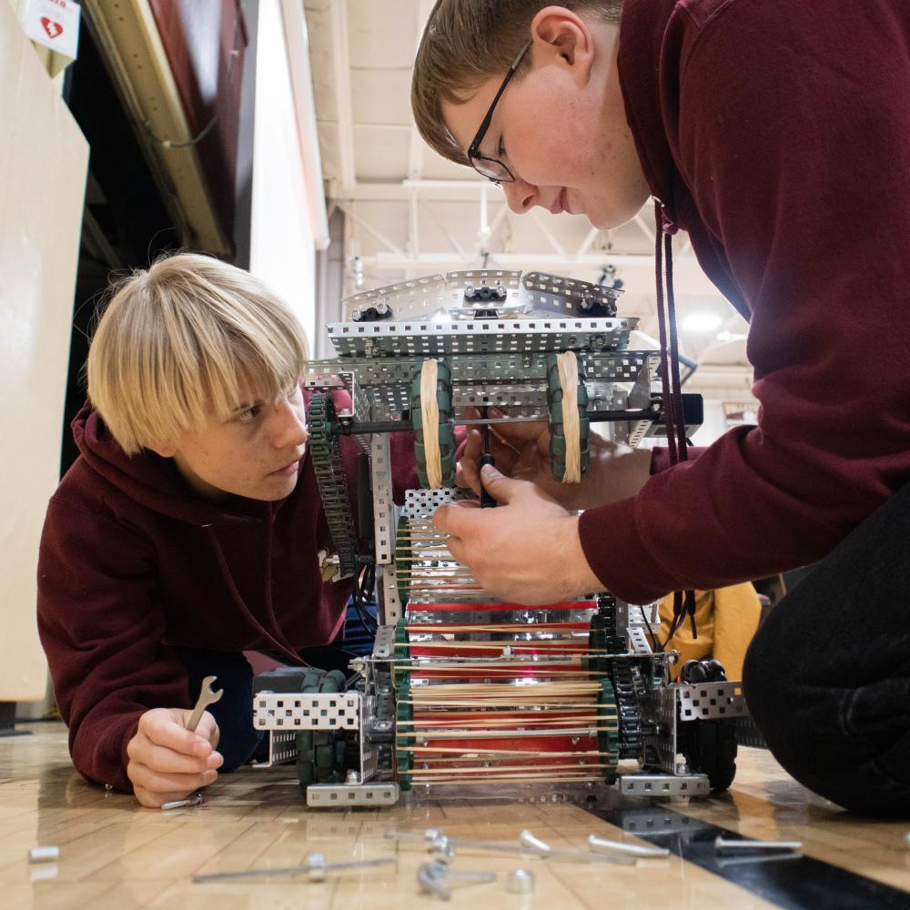 Old Colony Regional Vocational Technical High School students make adjustments to their robot, Ralph during the Vex Robotics Competition in February. Photo by Sawyer Smook-Pollitt