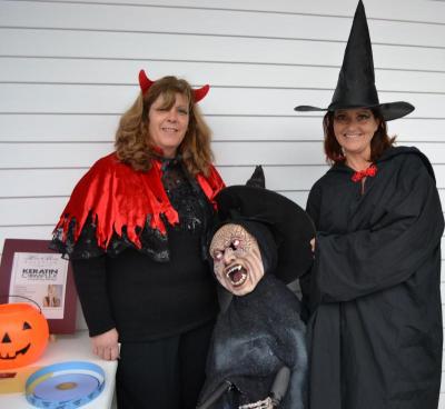 Susan McMullen, left, and Sarah Bolton, right, said that the annual Halloween Party is a donation to the community. BY JENNIFER HESHION