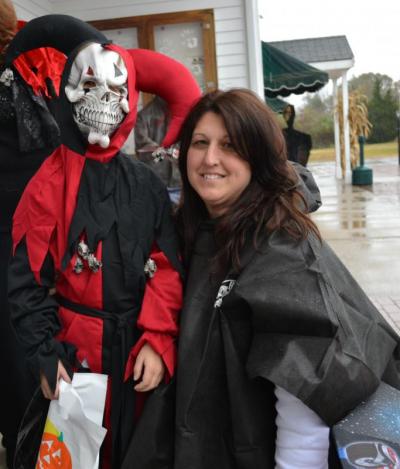 Hunter Reusch, left, and Nicole Reusch, right, of Mattapoisett, prepare to start trick-or-treating around the Plumb Corner Mall. BY JENNIFER HESHION