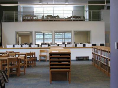 The library features a bank of computers and, at the back, a study area above a separate computer room. BY ANNE EISENMENGER