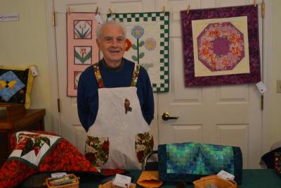 Together with his wife Pat, not pictured, Charlie Tate donated their quilted creations. BY JENNIFER HESHION