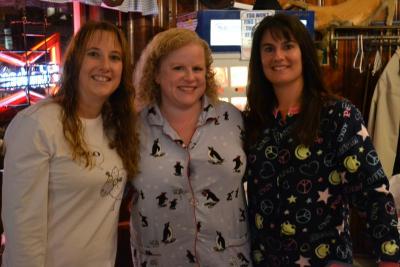 Committee member Julie Koczera, left, poses with other flannel-clad guests, Heather Bacchiocchi, and Lori Souza, right. BY JENNIFER HESHION