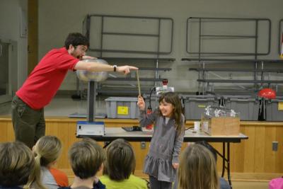 Andy Hall, left, and Bridget Farias test out a wooden stick to see if it is a good conductor of electricity. Turns out it wasn't. BY JENNIFER HESHION