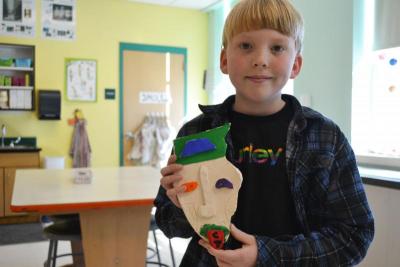 Charlie Tomlinson shows off his Kimmy Cantrell-inspired mask. He wrote his initials on the tongue. BY JENNIFER HESHION