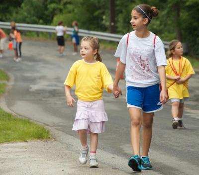 Younger students were paired with fifth and sixth grade buddies to keep them safe on their two-mile laps. BY GEORGIA SPARLING