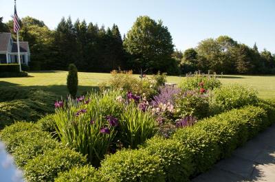 Just beyond the terrace is the Parterre Garden, inspired by the original 1916 landscaping and a French chateau. BY GEORGIA SPARLING