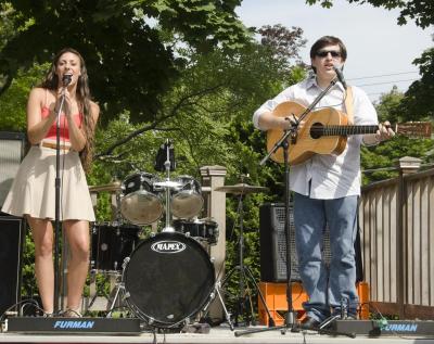 A harmonizing duo, Sarah Martin and Scott Bissonnette covered classics and new tunes on the Block Party stage. BY GEORGIA SPARLING