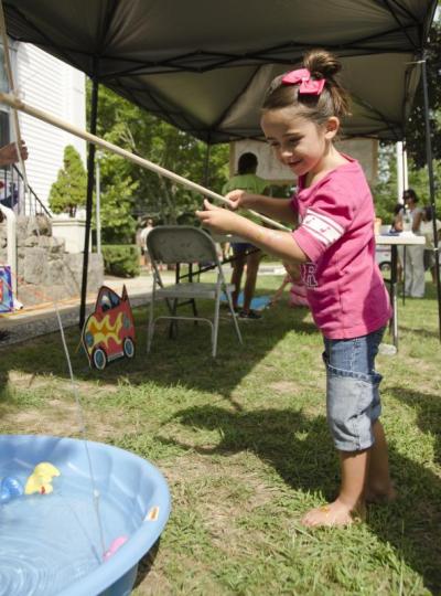 Olivia Carpenter, 5, was an expert at catching rubber duckies in the kid's tent. BY GEORGIA SPARLING