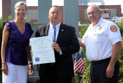 State Representative Susan Williams Gifford (R-Wareham) presented Lt. Donald Bliss with a certificate congratulating him for his 27 years of service to the Commonwealth. Former Wareham Police Chief Thomas Joyce (right), who currently serves as Marion Fire Chief, also offered his congratulations. BY JAIME REBHAN