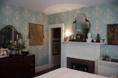 With damask wallpaper and antiques, the bedrooms feature are a step back into the Victorian era. BY GEORGIA SPARLING
