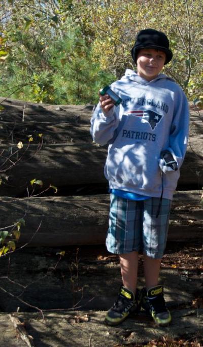 Eli Vidoni found the first cache hidden in a log near the cranberry bogs on the White Eagle property. BY GEORGIA SPARLING