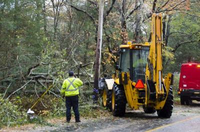 Marion's Department of Public Works sent out trucks and bulldozers to Point Road and Delano Road. BY GEORGIA SPARLING