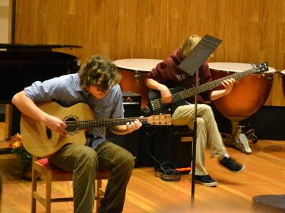 Ben Burns, left, performed his own composition on an acoustic guitar. Why? "I'm going to play a song that I wrote because my favorite thing is myself," he said. BY JENNIFER HESHION