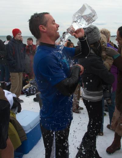 After the dip, Seth Spark of Marion broke out a cooler of warm water. "I do a lot of winter surfing so I'm prepared," he said. BY GEORGIA SPARLING
