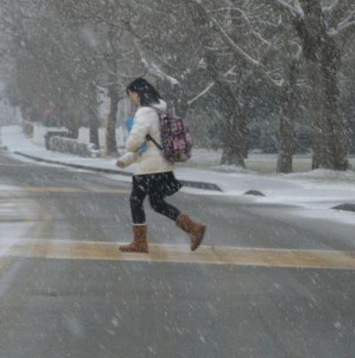 By Friday afternoon, it was near white out conditions as the snow came down. The snow sent one Tabor Academy student on a mad dash to get inside. BY JENNIFER HESHION