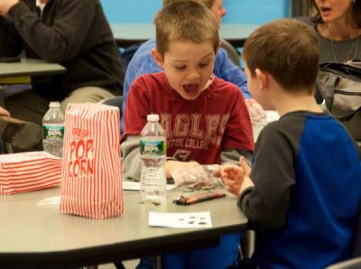 Student John Kassabian was itching to win during the first round of bingo at the Mattapoisett Parent TEacher Association's "Bingo for Books" event. BY GEORGIA SPARLING