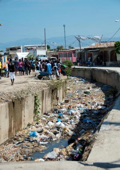 The air in the populous capital Port-au-Prince reeks with the smell of burning tires and garbage, highlighting the lack of infrastructure for the entire country. BY GEORGIA SPARLING