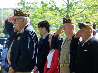 Post Commander Robert Demeo (left), Post Senior Vice Commander Richard Ziemba, and Post Chaplain Joseph Napoli offer a salute. BY MATTHEW BERNAT