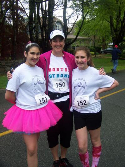 Kristine Silva, of Fairhaven, stands with her daughters Kennedy (left) and Meredith. The trio ran at the Tiara Classic 5K Mother's Day Race held on Sunday. BY MATTHEW BERNAT