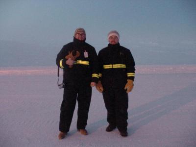 Edminster and Piché stand on the frozen Arctic Ocean at noon on a cold December day at the oilfield in Prudhoe Bay, Alaska where they tested a robot made for BP. BY ELECTROMECHANICA