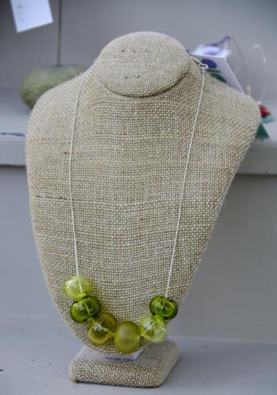 A first timer at the fair, Donna Andrews-Maness, of Swing Lane Studio, makes her own glass beads. BY GEORGIA SPARLING