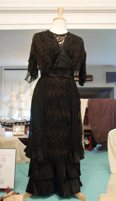 A "Downton Abbey era" dress from the museum's collection has elaborate hand beading made using knots. BY GEORGIA SPARLING