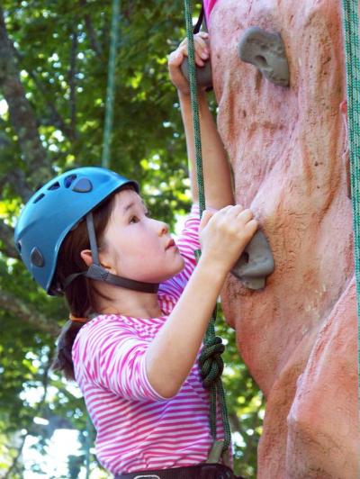 Ayaulym Wolfe, who was visiting Marion, concentrates on finding her way up the climbing wall. BY MATTHEW BERNAT