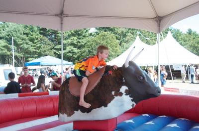 It's harder than it looks! Gibson Adams, 7, holds on for dear life on the mechanical bull. BY GEORGIA SPARLING