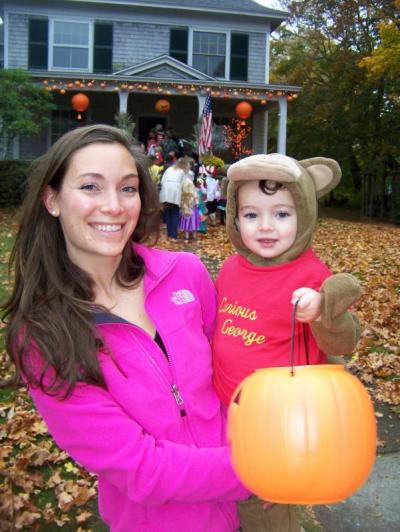 Tabitha Hayden and her son Ari, dressed as Curious George, are on the hunt for candy. BY MATTHEW BERNAT