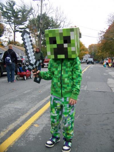 Patrick Shachoy, 8, wanders Spring Street as a “Creeper” from the video game Minecraft. He wasn’t the only one. Many kids were seen wearing the popular costume. BY MATTHEW BERNAT
