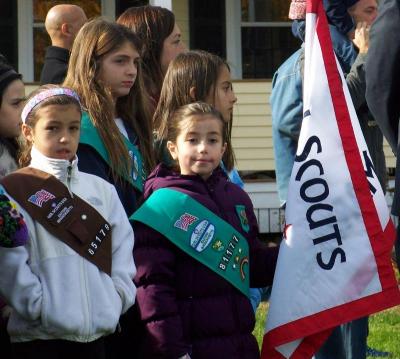 Girl Scout Amaya Macleod, center, of Marion's Troop 81177, stands with her fellow Scouts on Monday. BY MATTHEW BERNAT